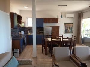 a kitchen and dining room with a table and chairs at Villa Paradiso in Ohrid
