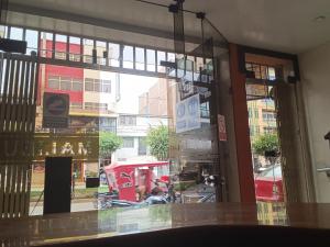 a view of a street from the window of a restaurant at Hotel Malibu in Chiclayo