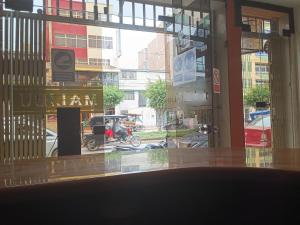 a view of a city street from a window at Hotel Malibu in Chiclayo