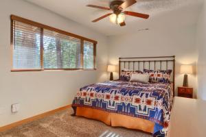 a bedroom with a bed and a ceiling fan at 10B Arrow Lodge in North Wawona