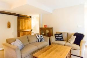 a living room with a couch and a coffee table at 09 Valhalla in Whistler