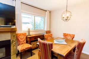 a dining room with a wooden table and chairs at 09 Valhalla in Whistler