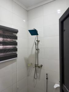 a bathroom with a shower with a shower head at Fimdah Hotel in Dushepe +35 photos