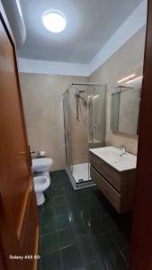 a bathroom with a shower and a sink and a toilet at Bed and Breakfast La Reale in Stintino +74 photos