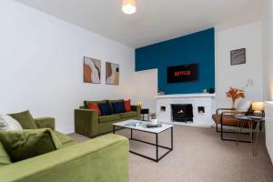 a living room with a couch and a fire place at 3BR Home in Darlington Contractor Rates in Darlington