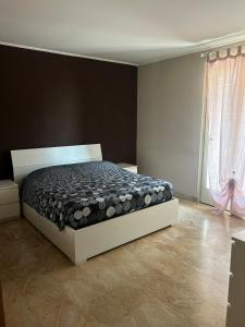 a bedroom with a bed in a room at Franciacorta Garden House in Cazzago San Martino