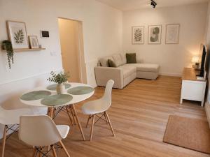 a living room with a table and chairs and a couch at House with a private pool, relaxation guaranteed in Talavera de la Reina