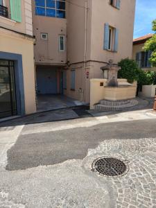 a building with a drain in the middle of a street at Luxuria - Jacuzzi et Hammam in Le Cannet