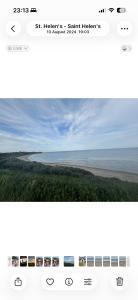 a screenshot of a website with a view of a beach at Golf central in Rosslare Harbour