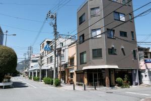 a building on the side of a street at 一組限定の宿 季の間 Private Traditional House & Tea Experience in Nagano in Iida