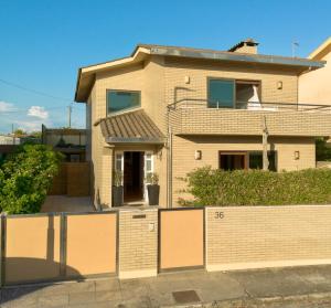 a house with a fence in front of it at Step by Step Atlantic Guesthouse in Vila do Conde