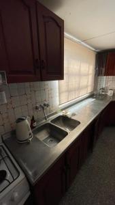 a kitchen with a sink and a counter top at Casa Rivadavia in Rafaela