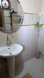a bathroom with a sink and a mirror at Kenzy House Abu Simbel in Abu Simbel +12 photos