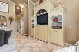 a living room with a tv and a couch at Casa Oasis Extra Large home centrally located in Springdale +22 photos