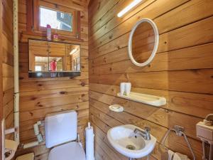 a bathroom with a white toilet and a sink at Zee van tijd in Kasterlee +40 photos