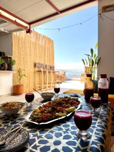 a table with a tray of food on a table at SeArt Home by the Ocean in Aourir +33 photos
