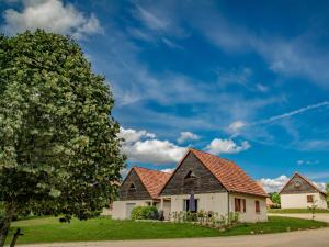 a house with a red roof and a tree at Lac Bleu 16 in Lacapelle-Marival