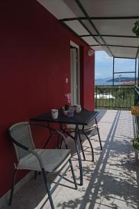 a black table and chairs on a patio at Apartments with parking space Slatine, Ciovo - 16732 in Slatine