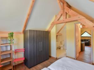 a attic bedroom with a bed and a bathroom at Lac Bleu huis nr 13 in Lacapelle-Marival +25 photos