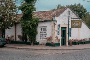 an old brick building on the side of a street at Epoca in Tandil