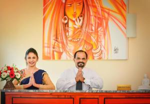 a man and a woman sitting at a counter with their hands in front at Grand Hills in Kandy +159 photos