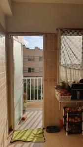 an open door in a kitchen with a window at Sweet Room in Casa in Casablanca