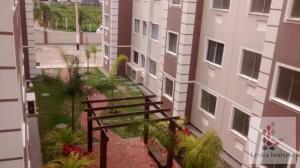 a view from a balcony of a building with a bench at Excellent value for money - Fully equipped apartment in Macaé