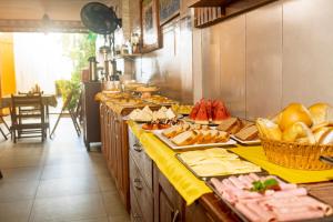 a buffet line with many different types of food at Tapirandú Pousada in Morro de São Paulo +22 photos
