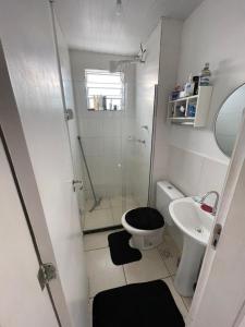 a bathroom with a shower and a toilet and a sink at Excellent value for money - Fully equipped apartment in Macaé +1 photo