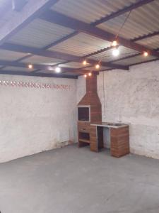 an empty room with a desk in a building at Container Loft Com Área de Churrasqueira Privativa in Piçarras