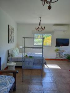 a bedroom with a bunk bed in a room at Loft Las Acacias in Potrero de los Funes