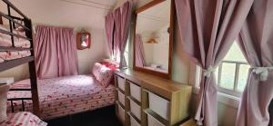 a bedroom with a bunk bed and a mirror at Meyenburg Family Room in Mount Morgan