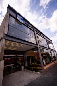 a building with a sign on the front of it at Airport Hotel Gru in Guarulhos