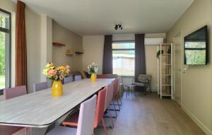 a conference room with a long table and chairs at 5 Bedroom Luxurious Home In Afferden in Afferden +28 photos