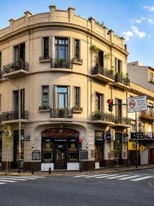a building on the corner of a street at Lezama Park ll in Buenos Aires