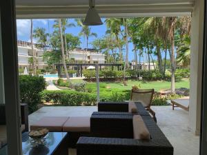 a living room with a couch and a view of a resort at Las Marías in El Morón