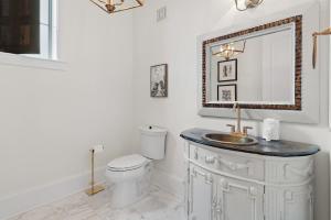 a bathroom with a sink and a toilet at 15 Mathis Cove in Inlet Beach +20 photos