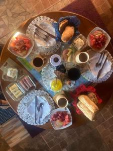 a table with a bunch of food on it at Hostal Art Gallery Chiloè in Castro