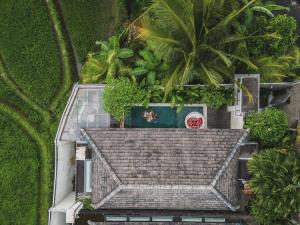 an overhead view of a house with a roof at Asvara Villa Ubud by Ini Vie Hospitality in Ubud