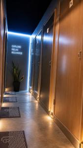 a hallway with lockers and a rug on the floor at Hashtag.Capsule.Hostel in Johor Bahru +10 photos