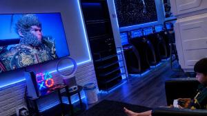 two children watching a movie in a dressing room at Hashtag.Capsule.Hostel in Johor Bahru