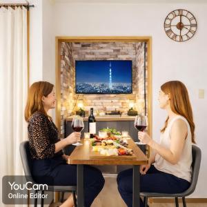 two women sitting at a table with wine glasses at Clair US Tokyo-Disney & Tokyo Sightseeing Base in Tokyo