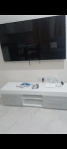 a white stove top in a white counter top at Sunset Apartment in Grand Anse