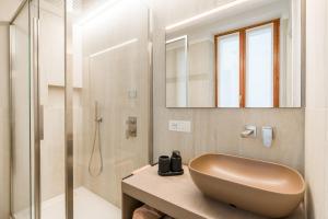 a bathroom with a sink and a shower at Alla Loggia in Udine