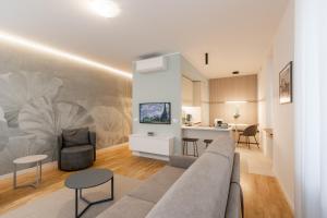 a living room with a couch and a table at Alla Loggia in Udine