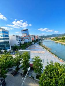 a view of a city with a river and buildings at Hồng Thu Hotel Cao Bằng in Cao Bằng