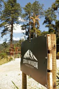 a sign for the sierra nevada lodge at Serra Nevada House in Nova Friburgo
