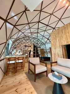 a living room with a couch and a table at Coconest THREE Langkawi in Tanjung Rhu