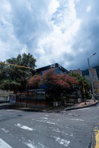 a building on the corner of a street with a traffic light at 5Q HOUSE Zona G in Bogotá