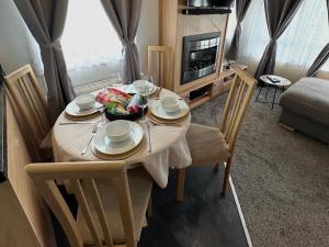 a dining room table with a bowl of food on it at C43 The Hideout in Rowen